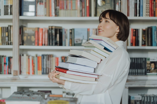 Girl Carrying Books