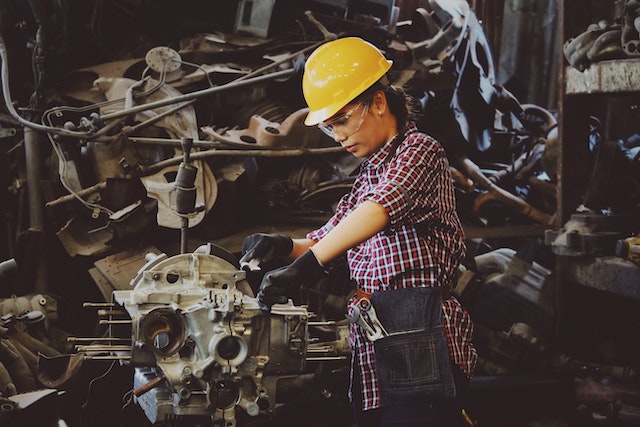 Girls fixing engine