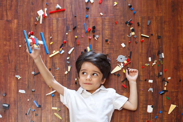 boy with legos on the floor