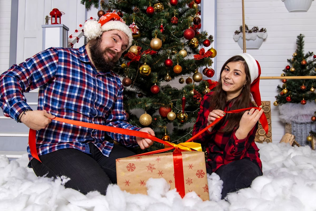 family opening christmas gifts