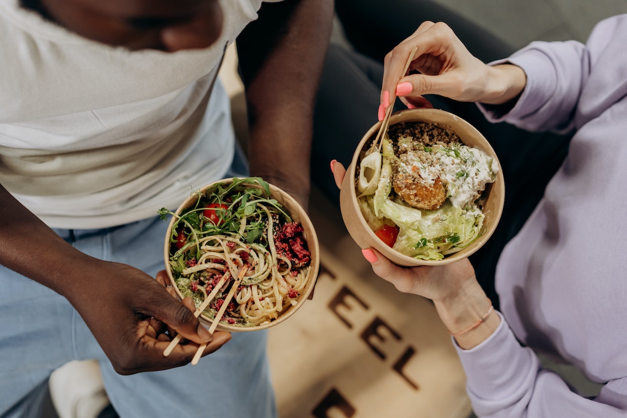 two women eating healthy food