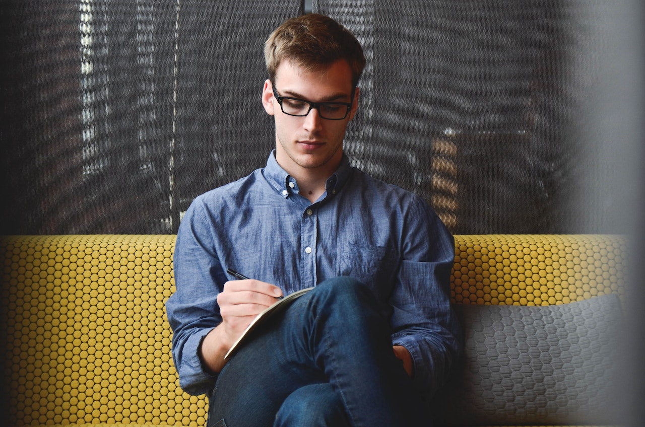 man taking notes