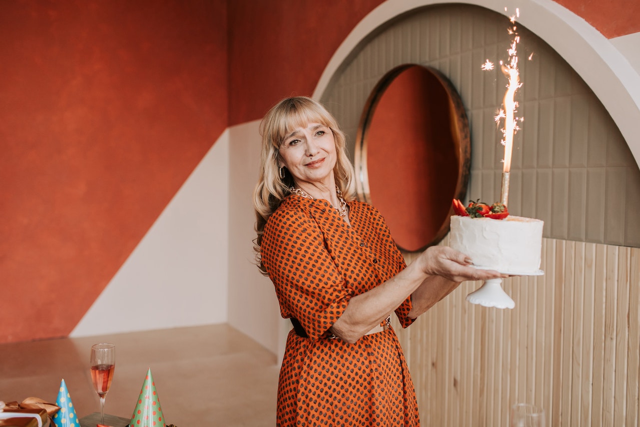 woman holding birthday cake