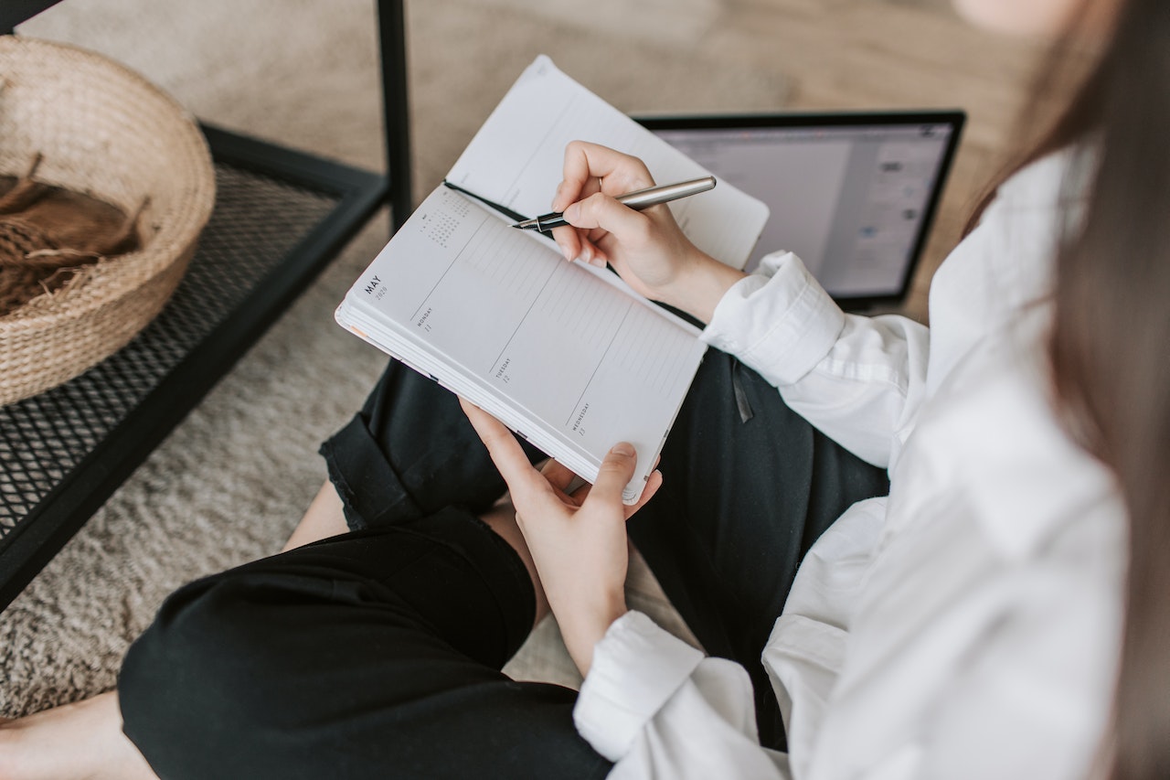 woman taking notes